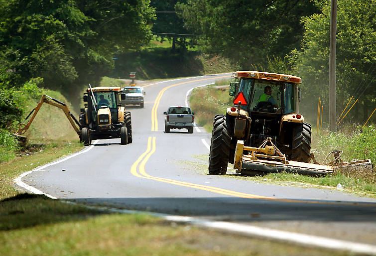 Heavy quiptment working on the side of the road